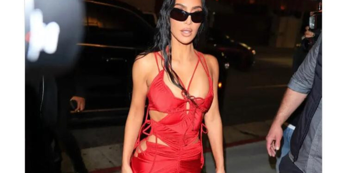 KIM KARDASHIAN TURNS HEADS IN FIERY RED DRESS AT STAR-STUDDED 43RD BIRTHDAY PARTY